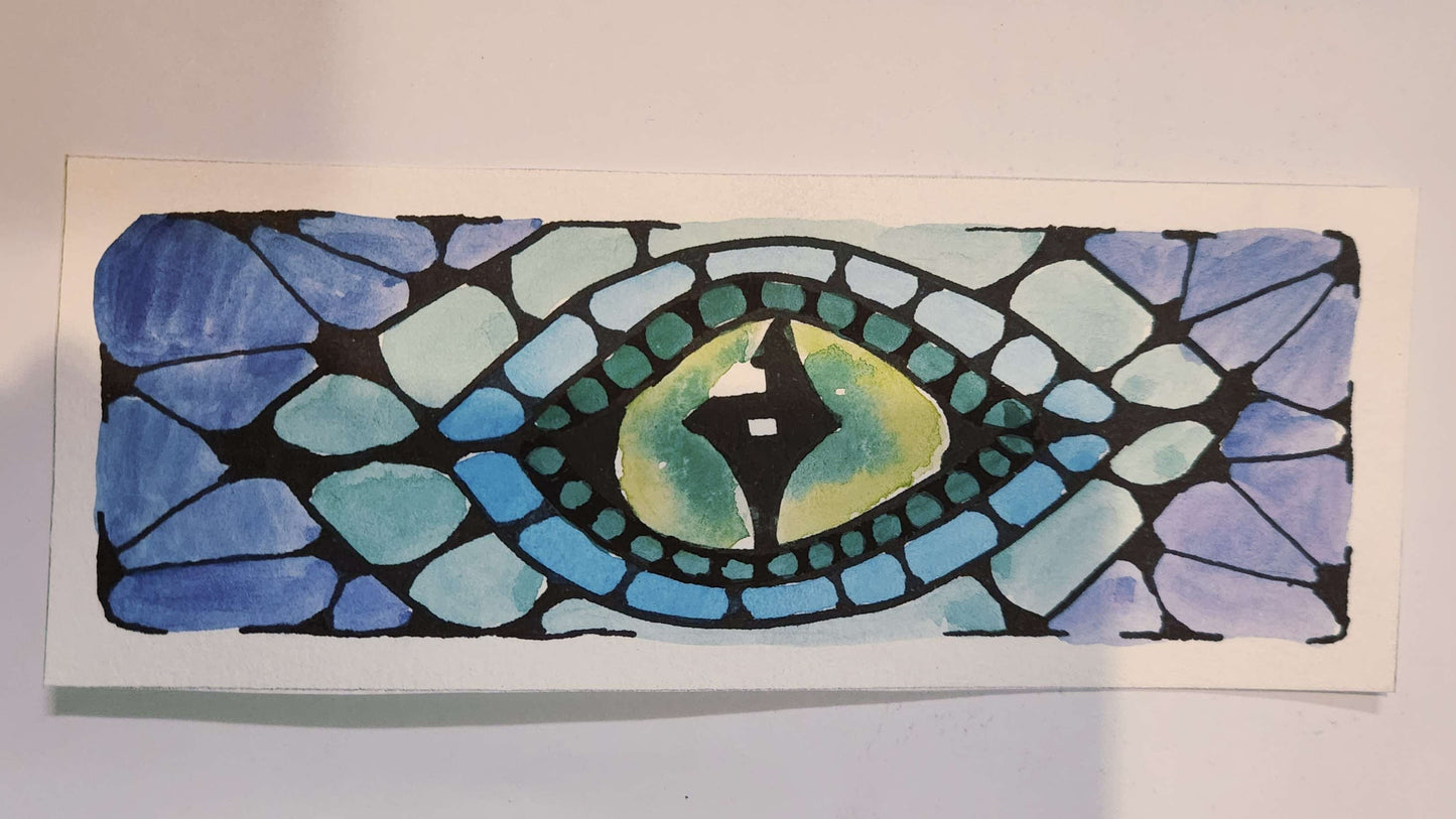 Stylized eye design with blue, green, and black colors on a white background