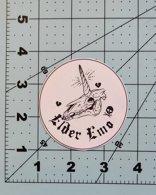 Circular sticker with text and design on a cutting mat