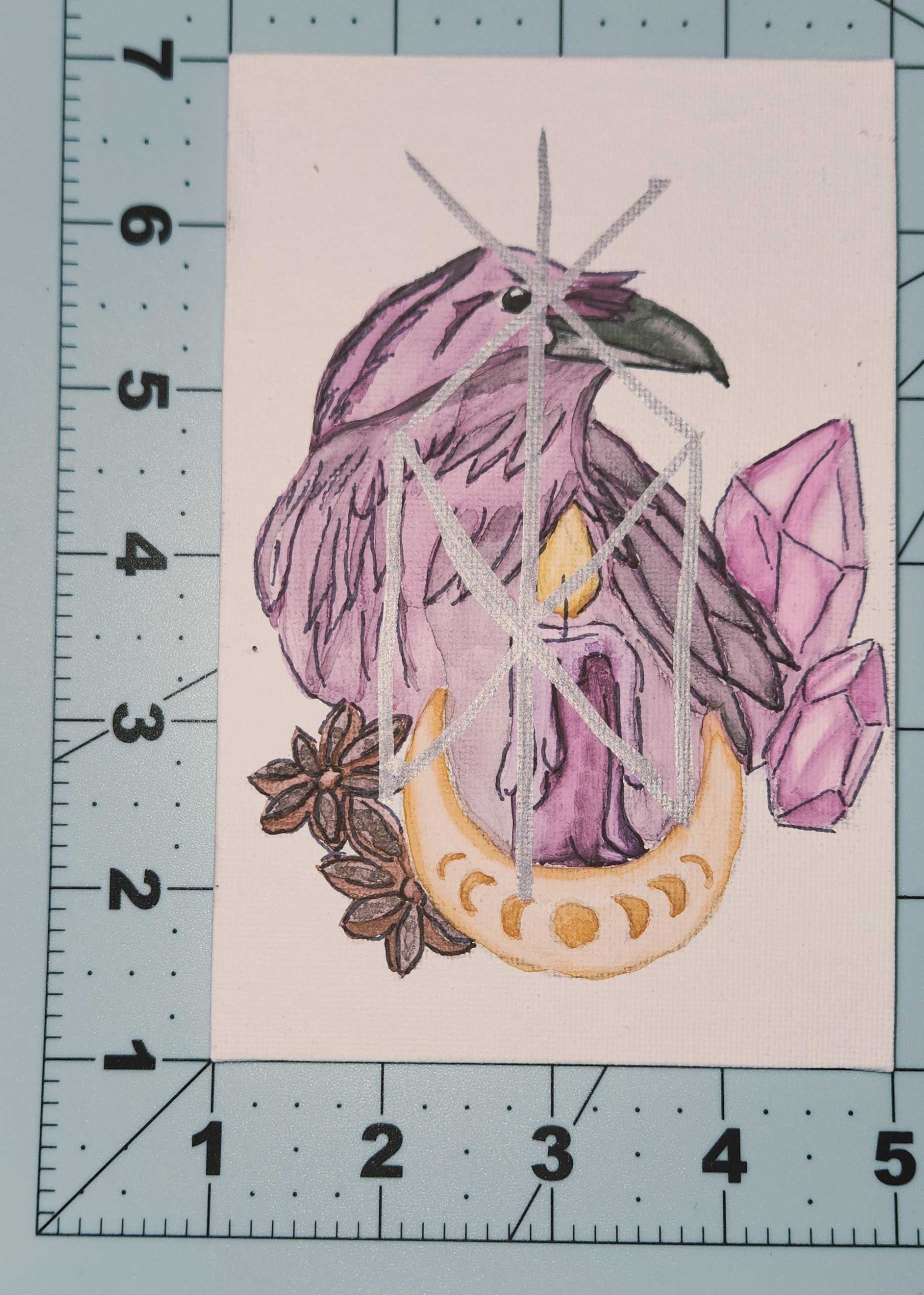 Illustration of a raven with crystals on a white background, measured against a cutting board
