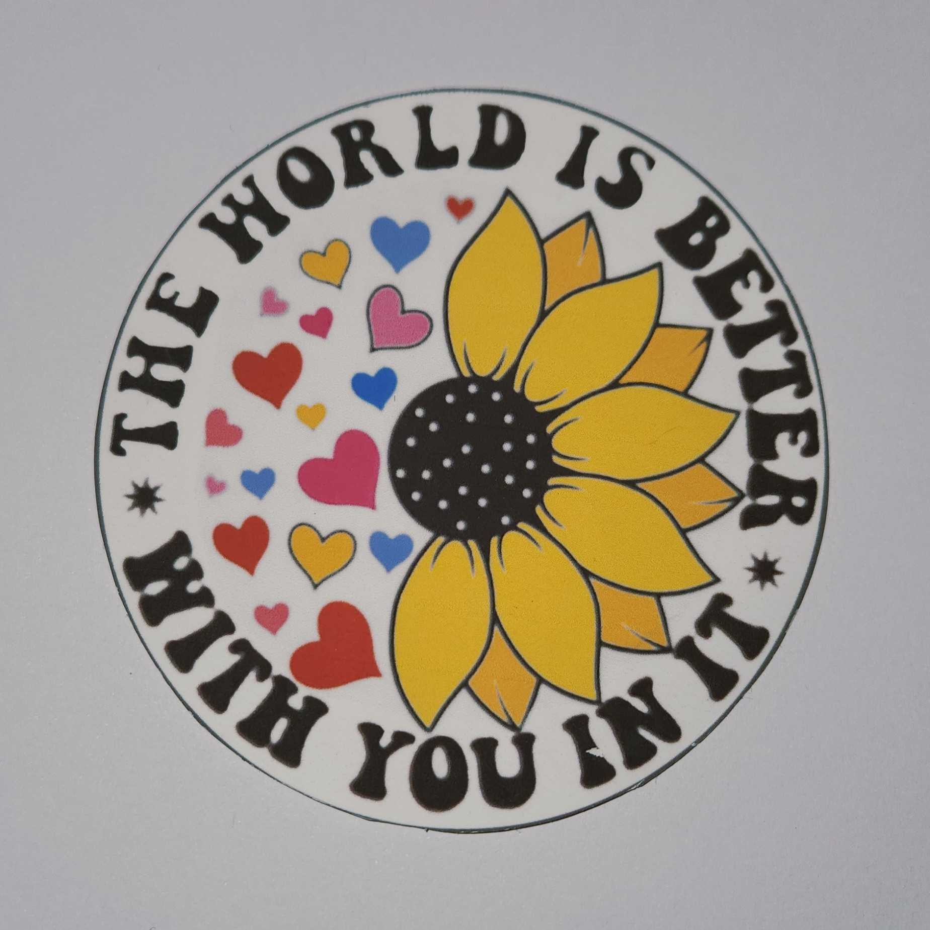 Circular design with a sunflower and hearts, featuring the text 'The world is better with you in it' on a white background.