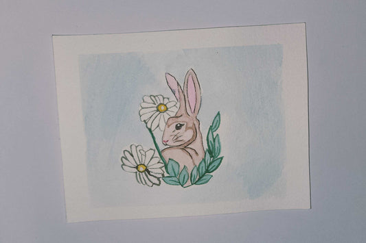 Illustration of a bunny with flowers on a white background