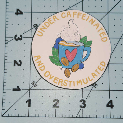Round sticker with colorful design on a cutting mat